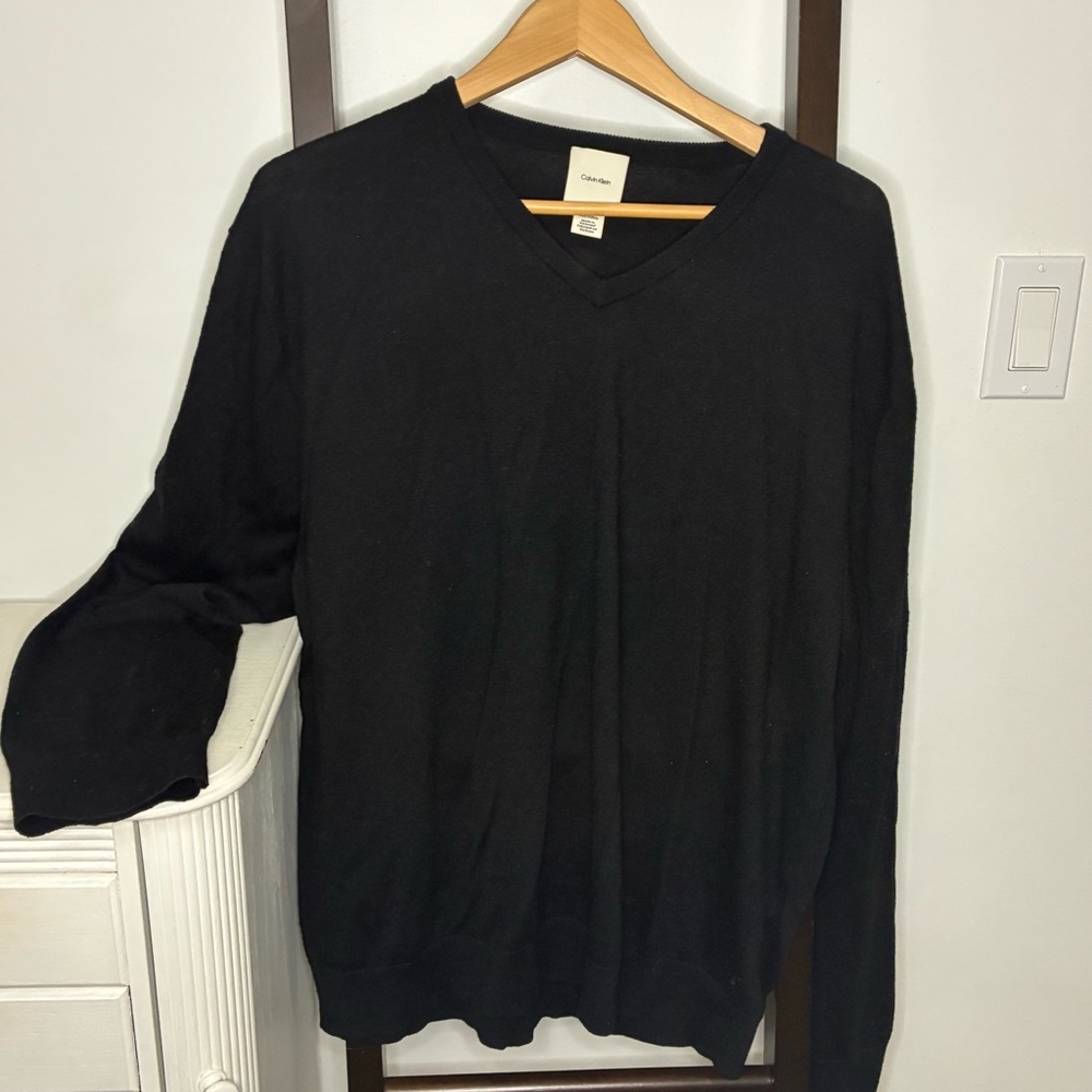 Calvin Klein black sweater. Size XXL.
Possibly a wool blend.